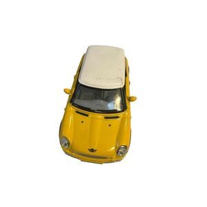 This vibrant yellow and white toy car